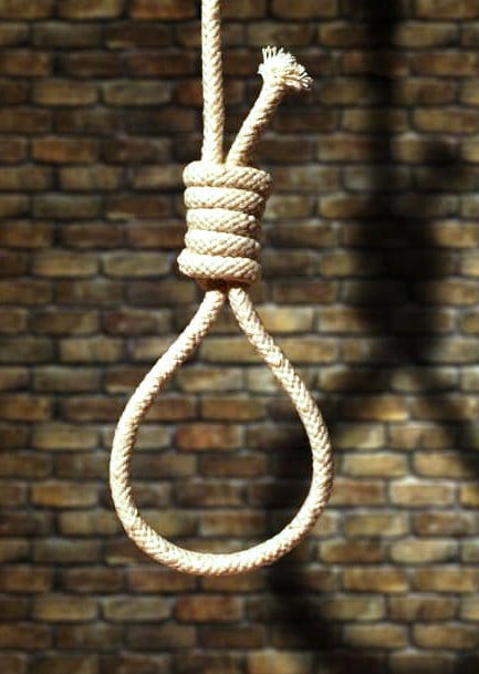 suicide concept. noose with shadow on dark wall background